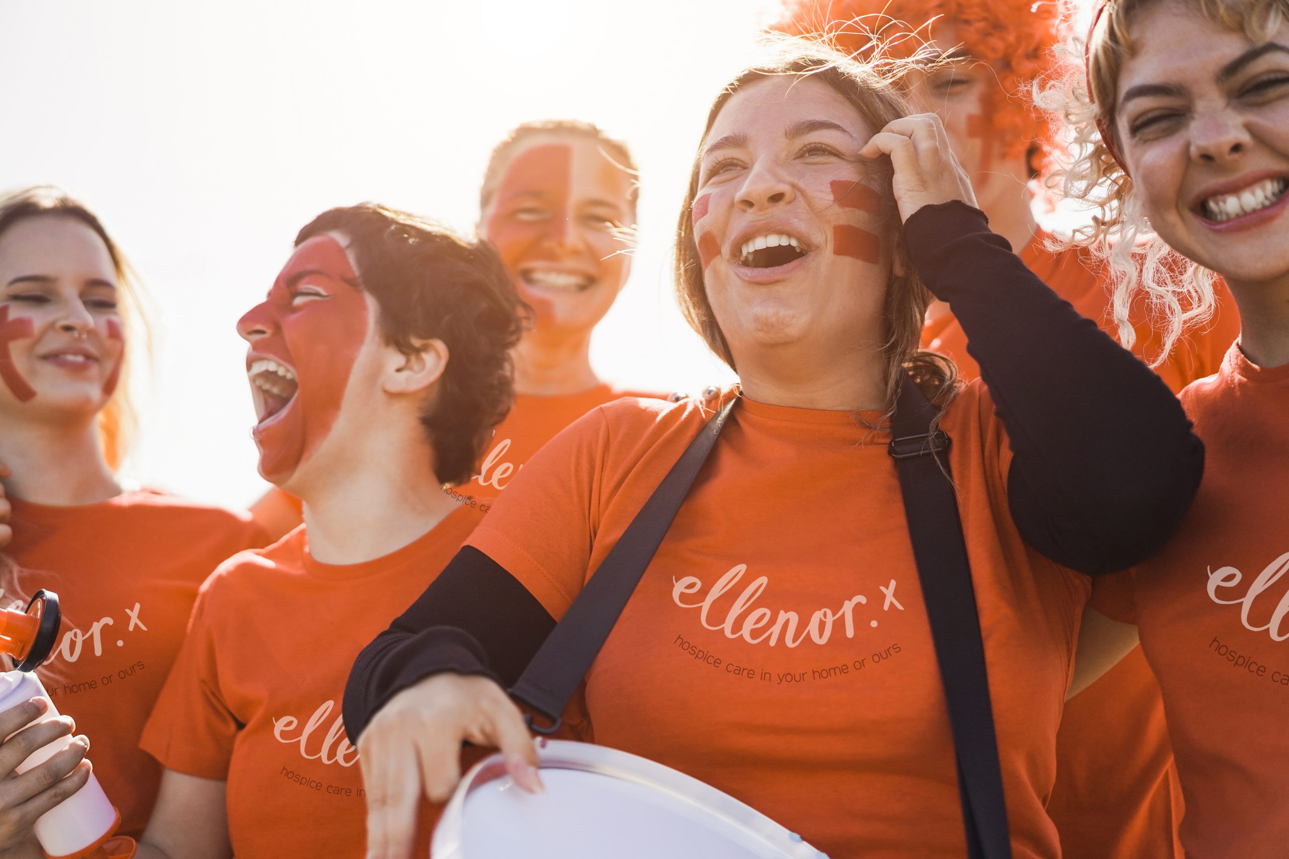 orange-sport-football-fans-screaming-while-supporting-their-team-out-stadium-focus-girl-holding-drum